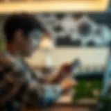 A student analyzing different debit cards on a laptop