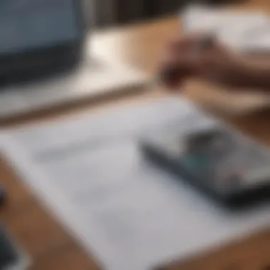 A person analyzing expenses on a budget sheet with a checkbook